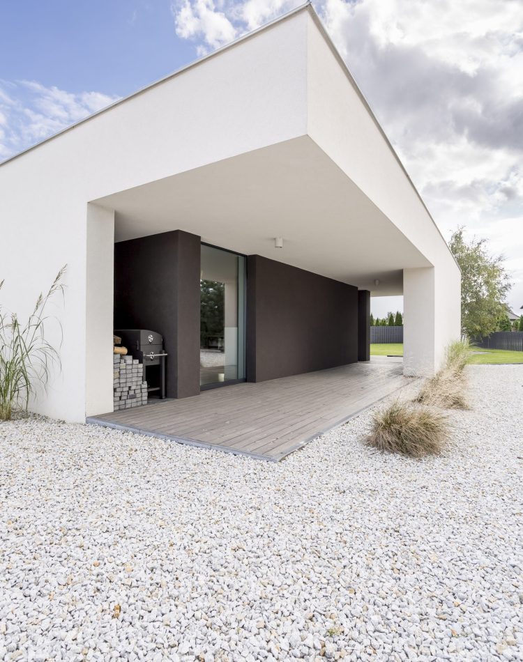 Backyard of modern, minimalistic house in daylight